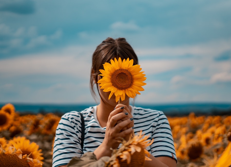 woman with a sunflower
